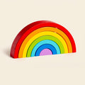 Classic wooden rainbow stacker on a cream background