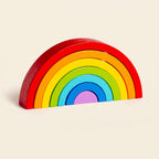 Classic wooden rainbow stacker on a cream background