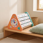 Wooden learning triangle toy on a low Montessori shelf in a calm playroom