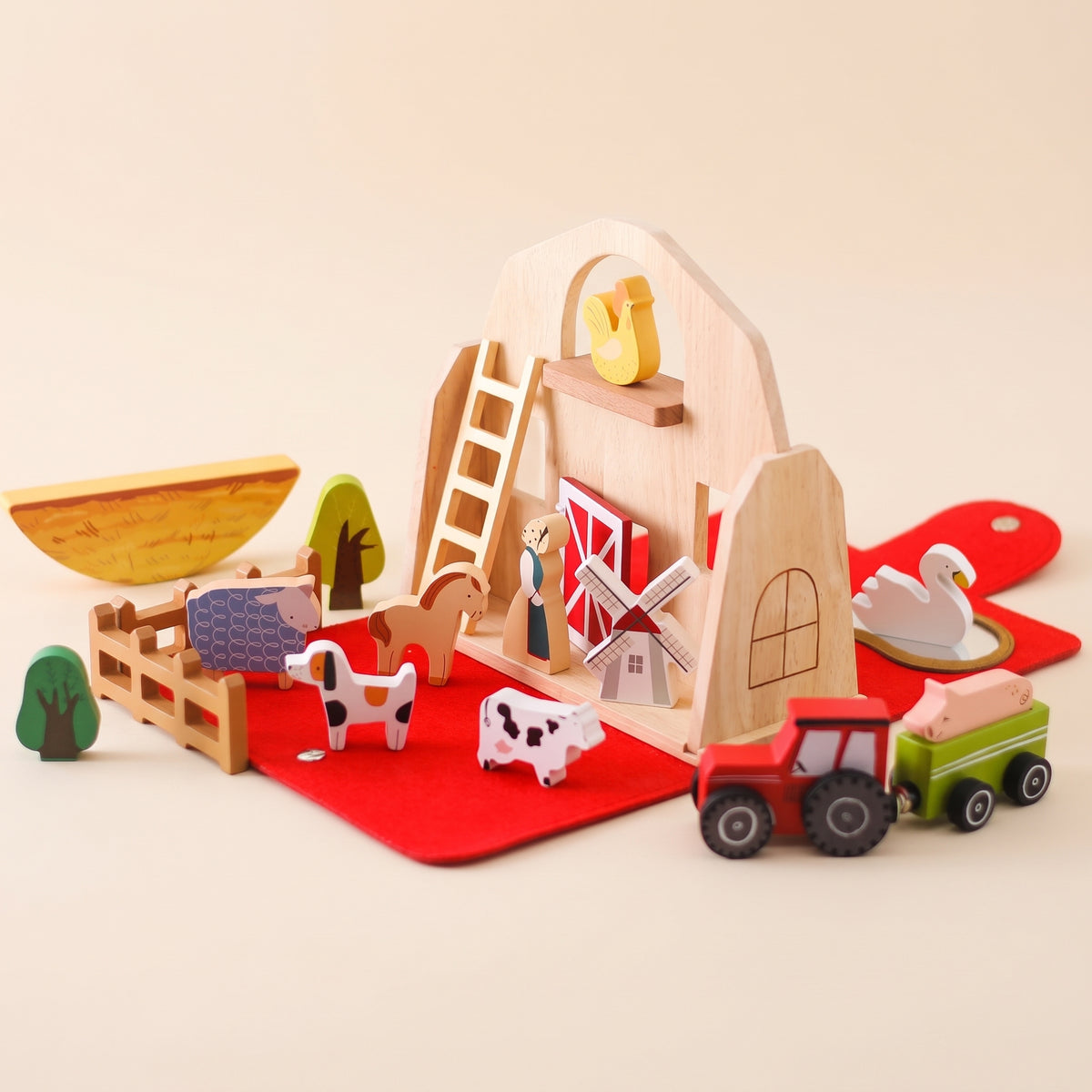 Wooden farm barn play set with animals, tractor and red felt mat