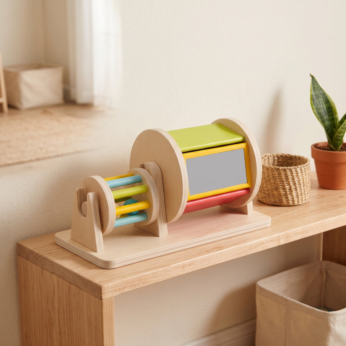 Wooden spinning drum toy on a Montessori shelf