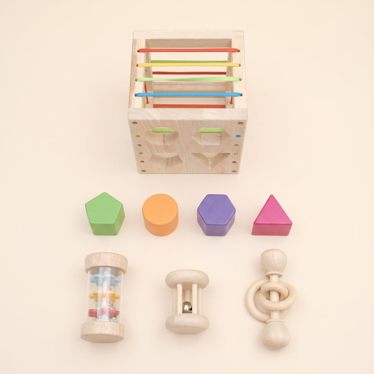Everything in the set: cube, four shape blocks and three rattles