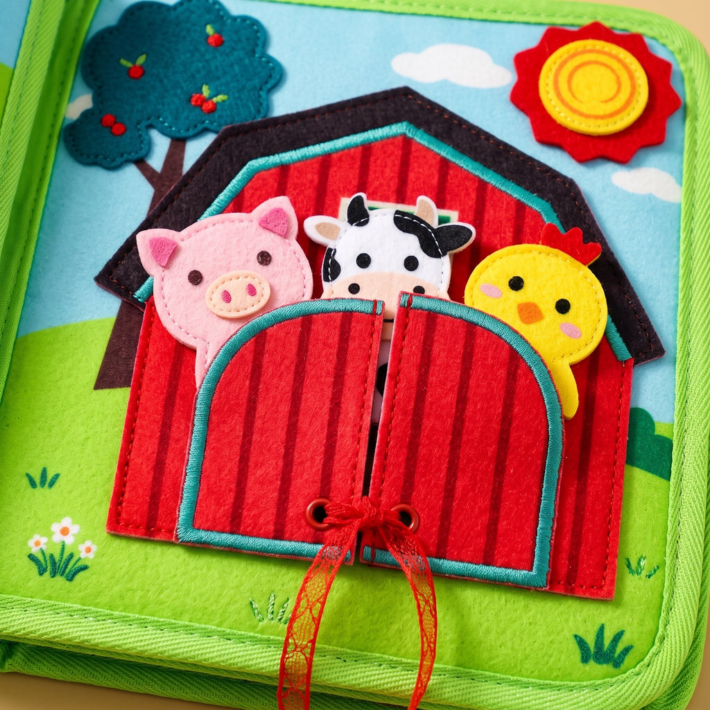 Close-up of the barn page with its red lace and felt animal puppets