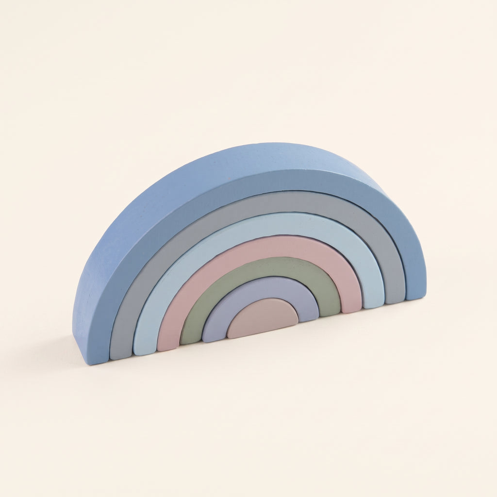 Haze Blue wooden rainbow stacker on a cream background
