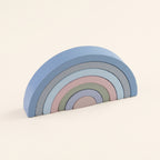 Haze Blue wooden rainbow stacker on a cream background