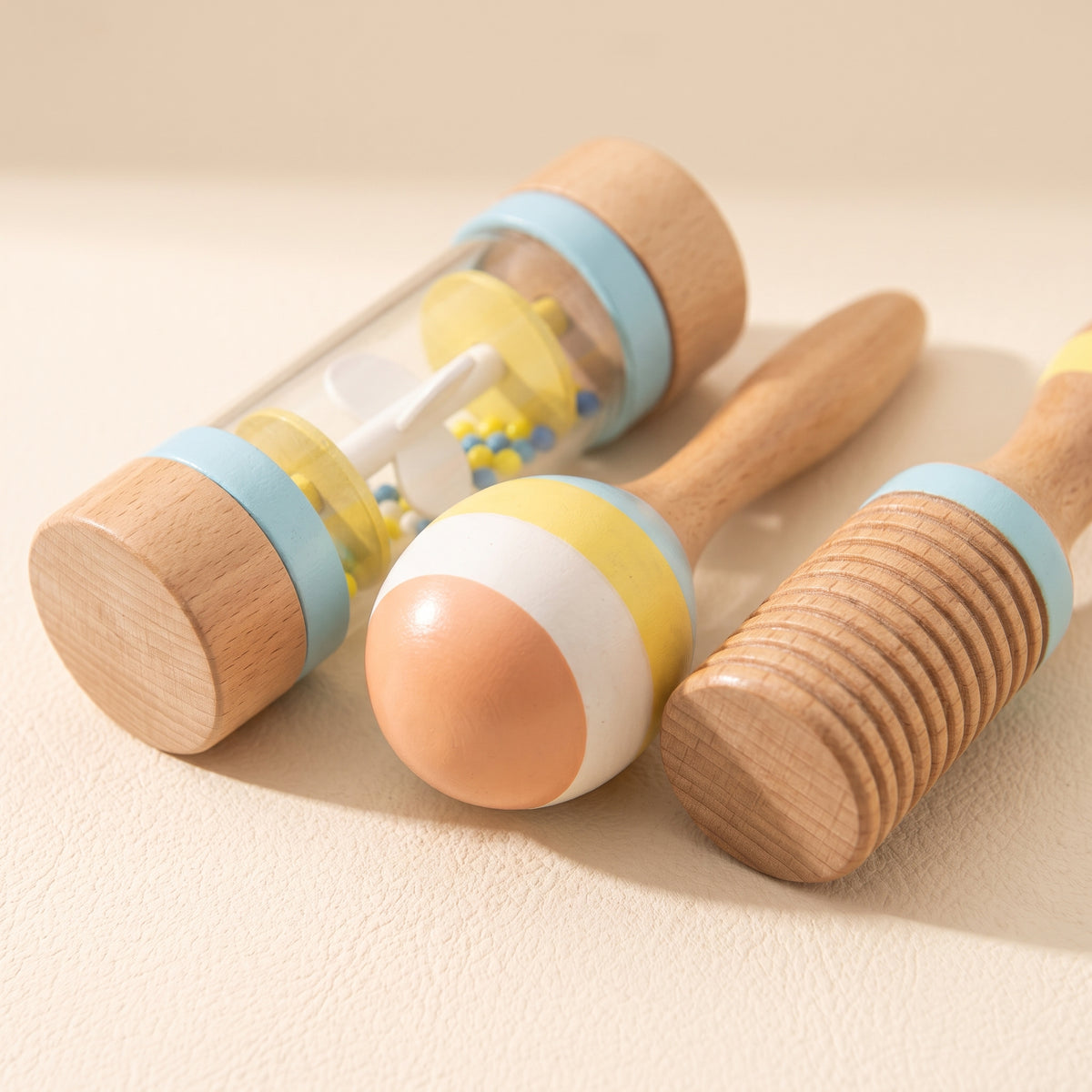 Close-up of the wooden rain stick, striped maraca and ridged guiro