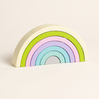 Macaron pastel wooden rainbow stacker on a cream background