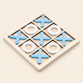 Wooden noughts and crosses board with blue crosses and white noughts