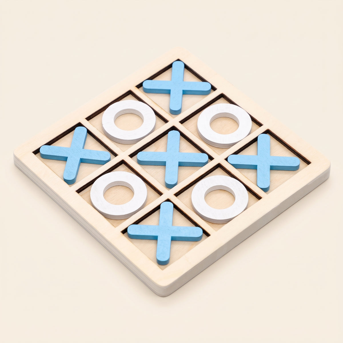Wooden noughts and crosses board with blue crosses and white noughts
