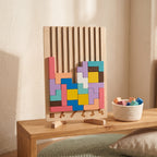 Wooden block puzzle board on a low Montessori shelf