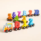 Wooden magnetic number train with a crocodile engine and colourful number wagons from 0 to 10 on a cream background