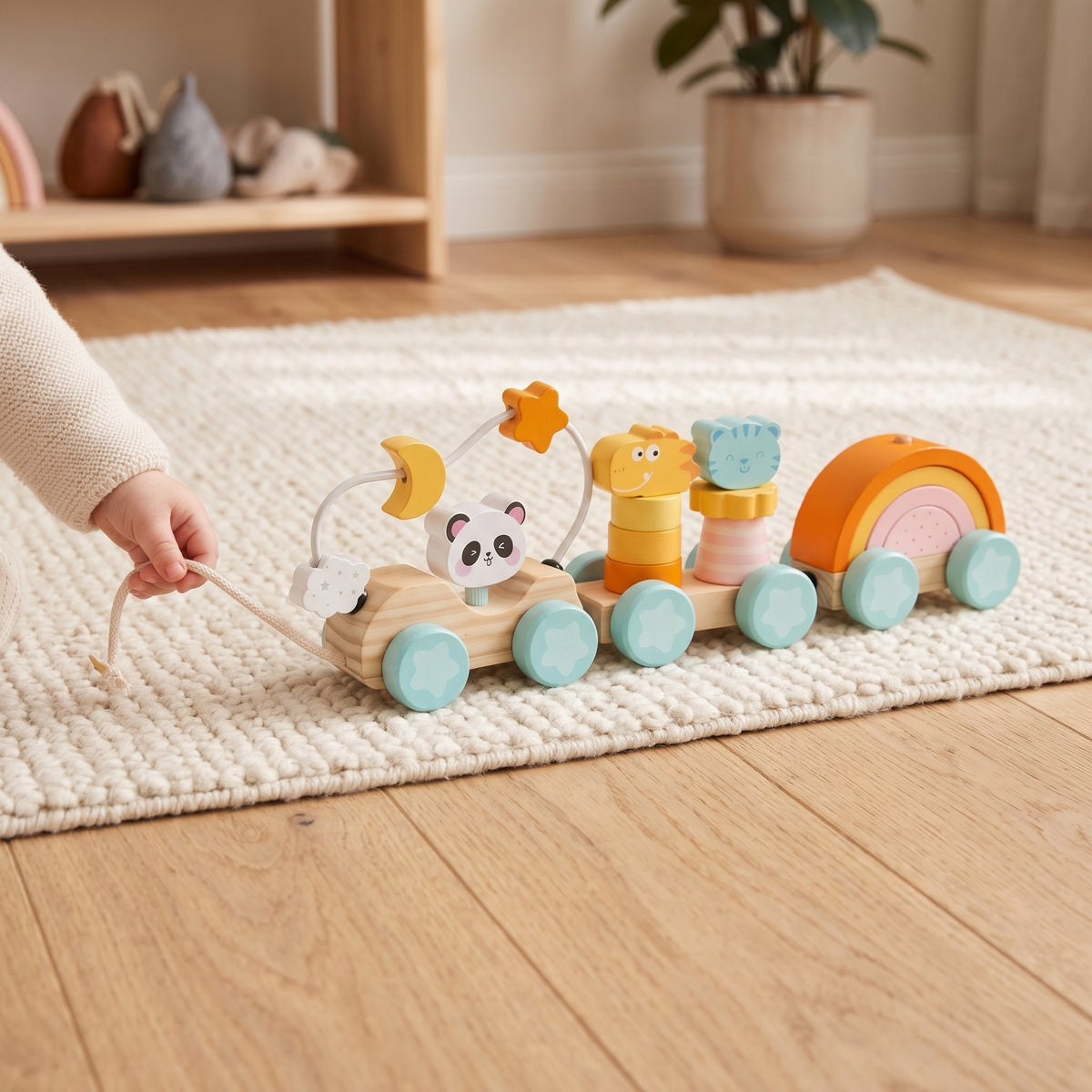 Toddler pulling the wooden train along by its rope