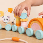 Child placing the tiger piece on the stacking carriage