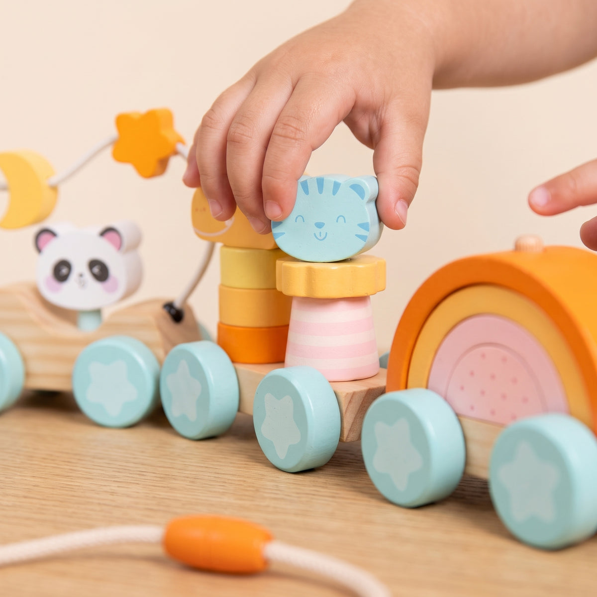 Child placing the tiger piece on the stacking carriage