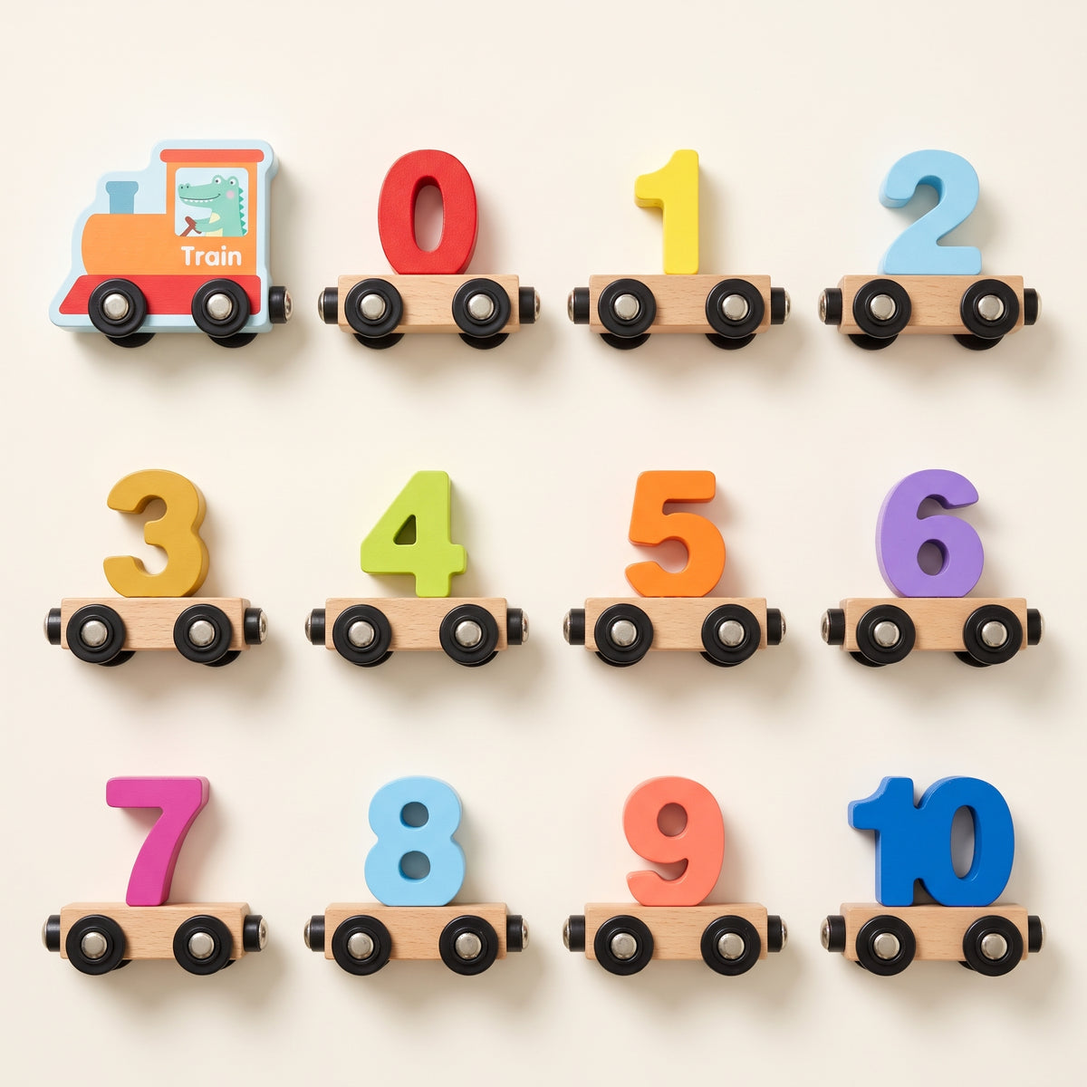 All 12 pieces of the wooden number train laid out: the engine and wagons 0 to 10